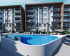 Kuşadası'nda Yatay Mimari Havuzlu Sitede Gayrimenkuller