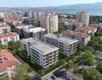 Apartments in a Complex with a Pool Near the Sea in İzmir Karşıyaka 1