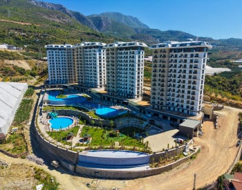 Alanya Mahmutlar’da Dört Bloklu Sitede Kale Manzaralı Daireler 1