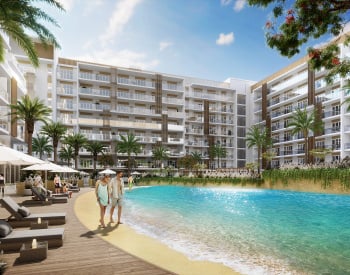 شقق في مشروع يضم مسبحًا بتصميم البحيرة في دبي ستوديو سيتي