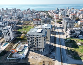 Квартиры в комплексе у моря в Махмутларе, Аланья
