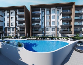 Kuşadası'nda Yatay Mimari Havuzlu Sitede Gayrimenkuller