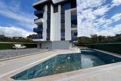 شقق ضمن مجمّع سكني قريب من الشاطئ في ألانيا 1