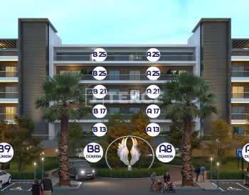 Kuşadası'nda Havuzlu ve Deniz Manzaralı Sitede Daireler 56