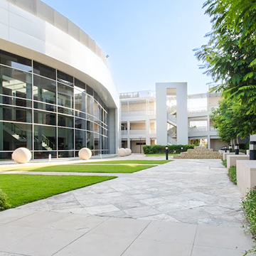 white building with green spaces