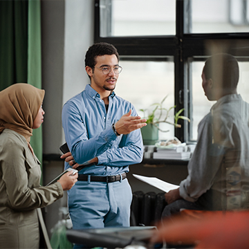 a group talking to eachother in office a group talking to eachother in office