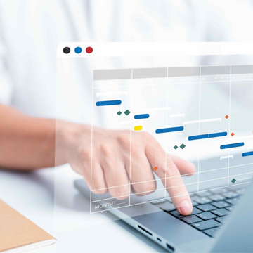 person typing on laptop while weekly plan hovering front of it