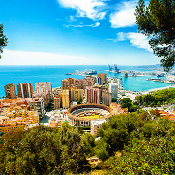 city and sea view from hill with a monument in spain 