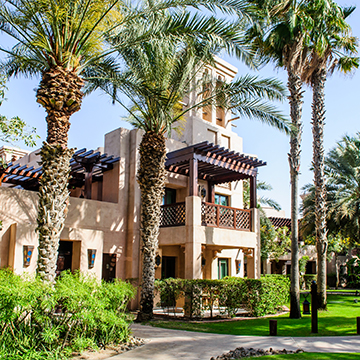 a expensive house surrounded with trees and greenery a expensive house surrounded with trees and greenery