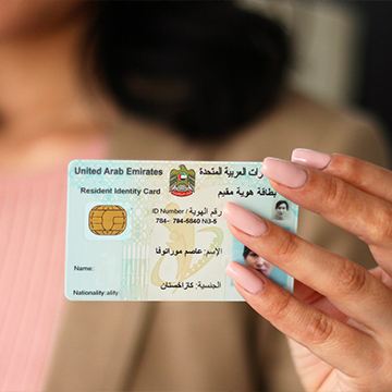 woman holding a id card woman holding a id card