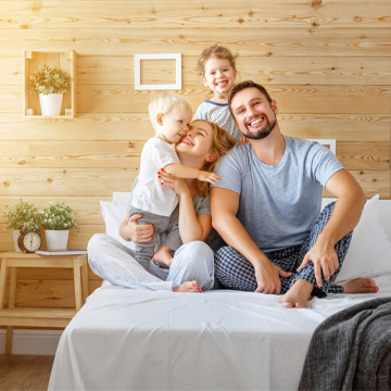 happy family in bedroom with sunlight