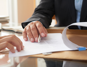 person filling out an application form person filling out an application form