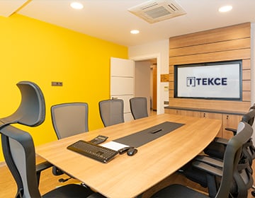 a meeting room with yellow walls