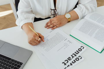 A person is reading a contract A person is reading a contract