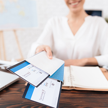 Happy traveler handing flight tickets, ready for a trip after learning about North Cyprus travel requirements Happy traveler handing flight tickets, ready for a trip after learning about North Cyprus travel requirements