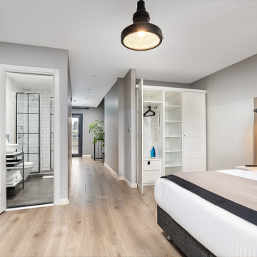 ¿Cuáles son los beneficios de invertir en bienes raíces generadores de ingresos?